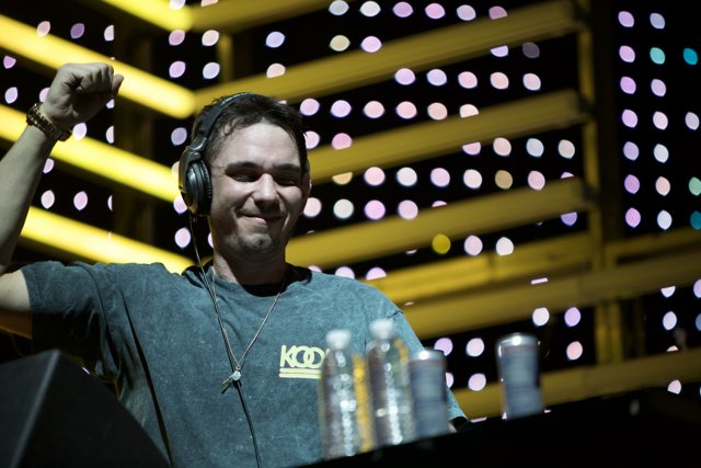 DJ AM Performing with Headphones On