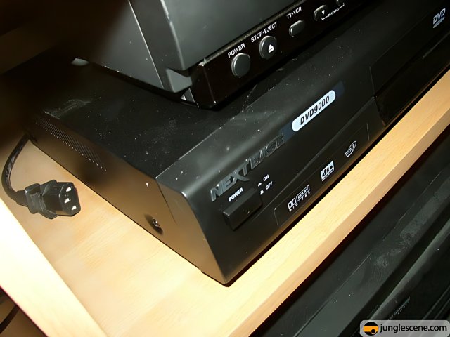 DVD Player and Remote Control on Shelf