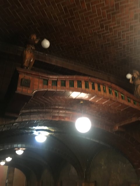 Illuminating Statues in a Brick Ceiling