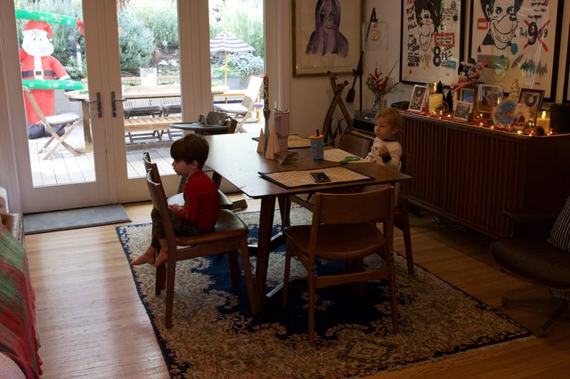 Children at Homework Table During Christmas Season