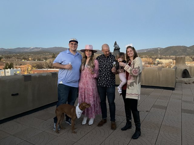 Family and Furry Friend on a Rooftop