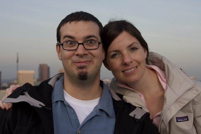Couple Smiling Together Against City Skyline