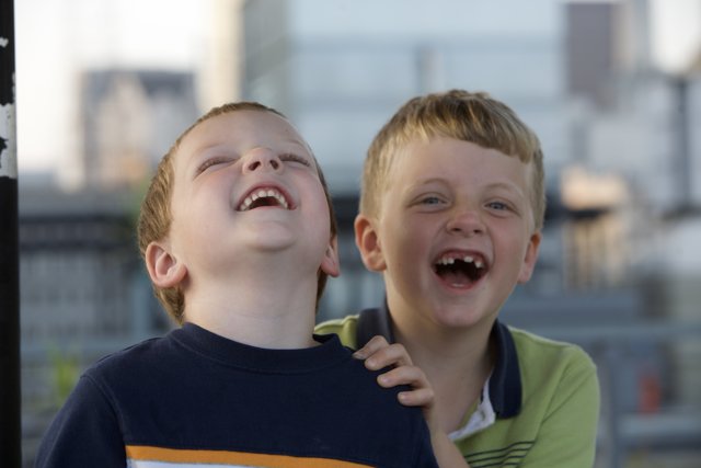 Two Boys Sharing Laughter Together