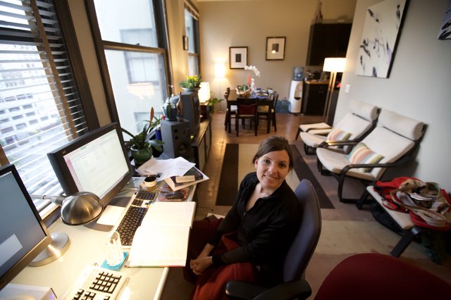 Woman Smiling at Home Office Desk Setup