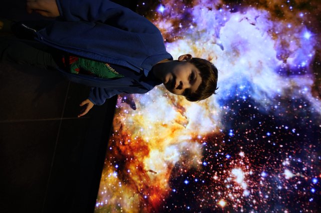 Contemplation Beneath the Cosmic Nebula Display