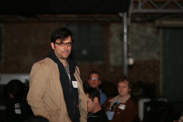 Man in Glasses Addresses an Audience at Barcamp 2006