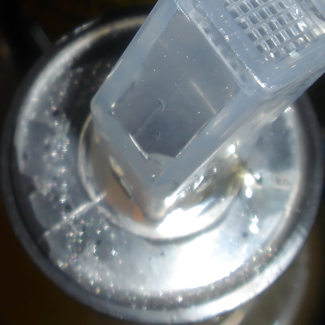 Plastic Container with Protruding Plastic Piece