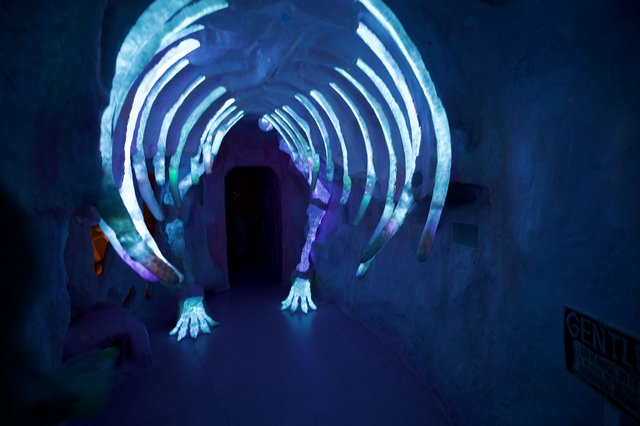 Illuminated Ice Tunnel with Glowing Blue Arches