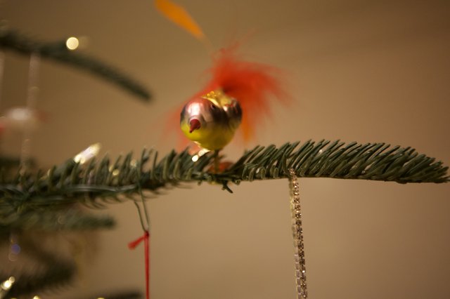 Vintage Glass Bird Ornament on Evergreen Branch
