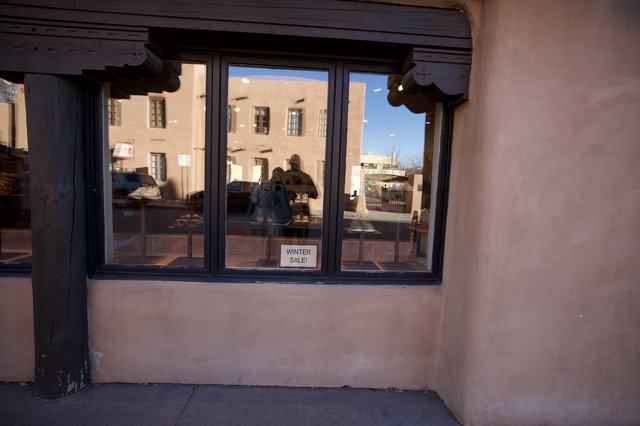 Adobe Storefront Window Display at Sunset in Santa Fe