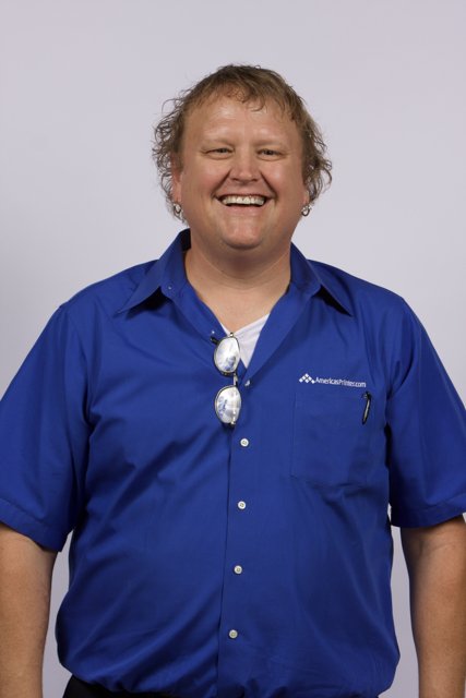 The Smiling Man in a Blue Dress Shirt