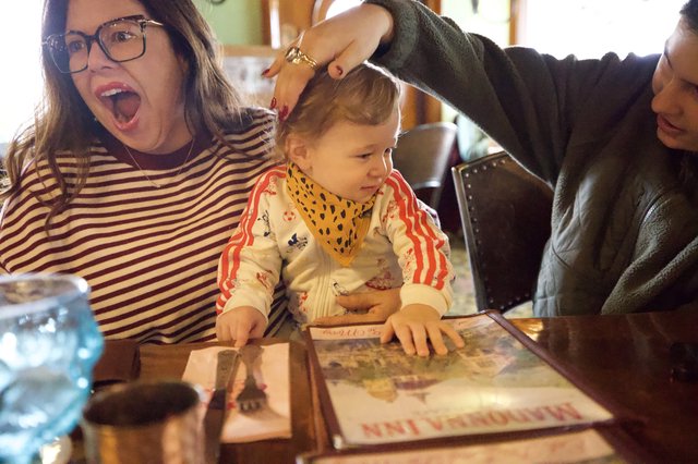 Joyful Family Moment During Child's First Haircut