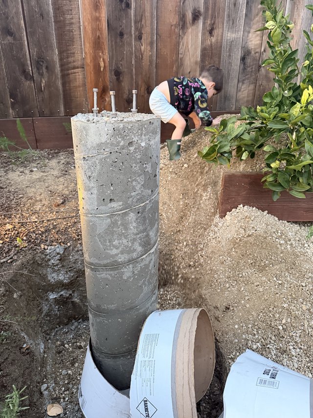 Concrete Pier Foundation with Anchor Bolts in Backyard