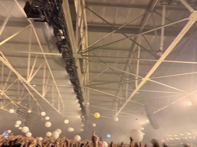 Illuminated Concert Venue Ceiling with Dramatic Lighting