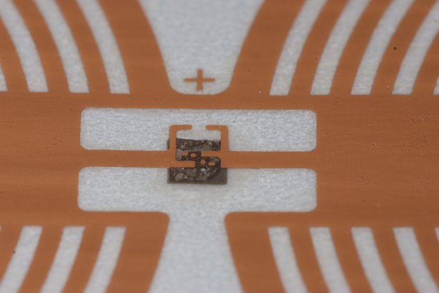 Cross Symbol on Metal Hardware