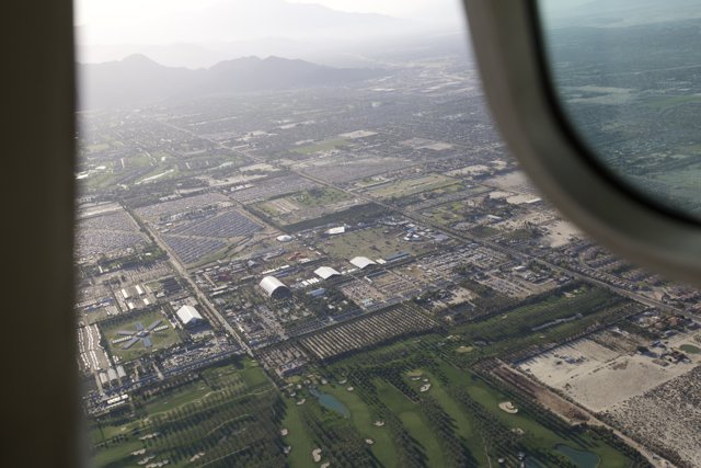 Aerial View of Urban Metropolis from Airplane Window