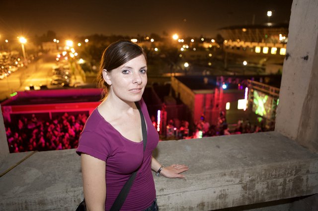Woman Overlooking Electric Daisy Carnival at Night