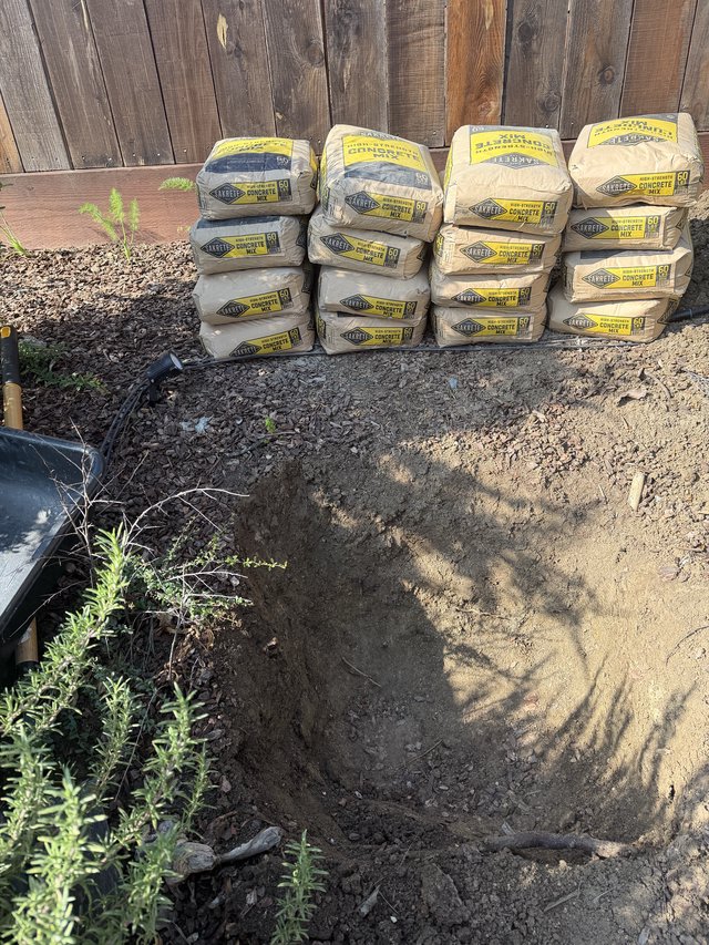 Sakrete Concrete Mix Bags Stacked for Backyard Project