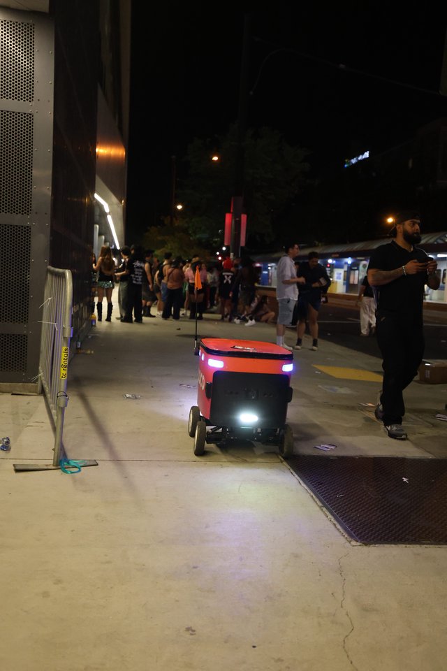 Autonomous Delivery Robot Navigates Nighttime Festival Crowd
