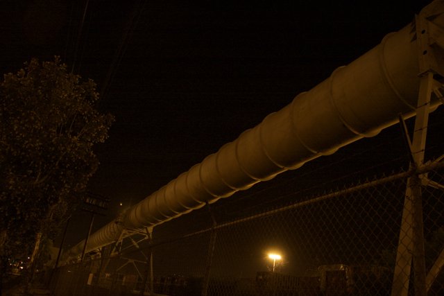 Industrial Pipeline at Night