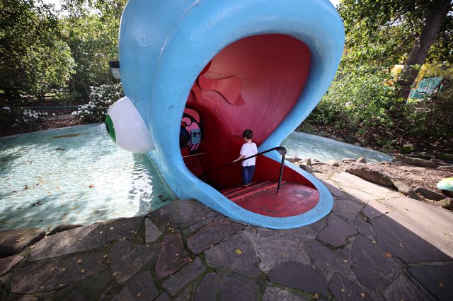 Child Exploring Giant Whale Mouth Playground Structure