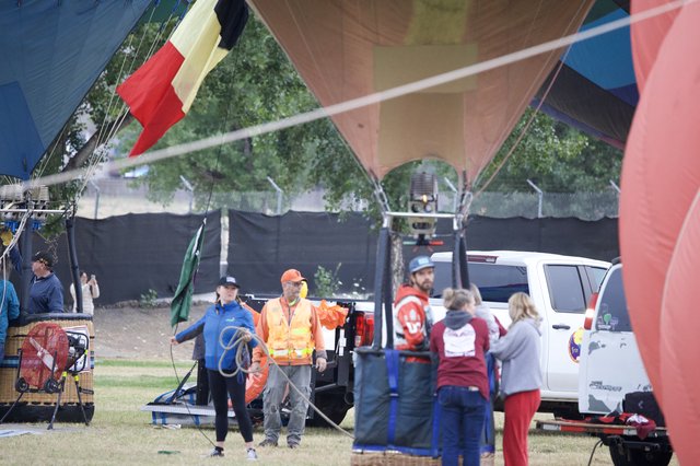 Ground Crew Prepares Hot Air Balloons for Launch