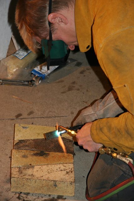 Man welding wood