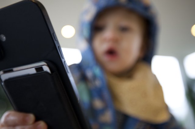 Blurred Selfie Portrait with Smartphone in Focus