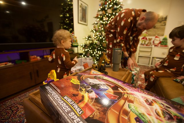 Christmas Morning Unwrapping Presents with Family