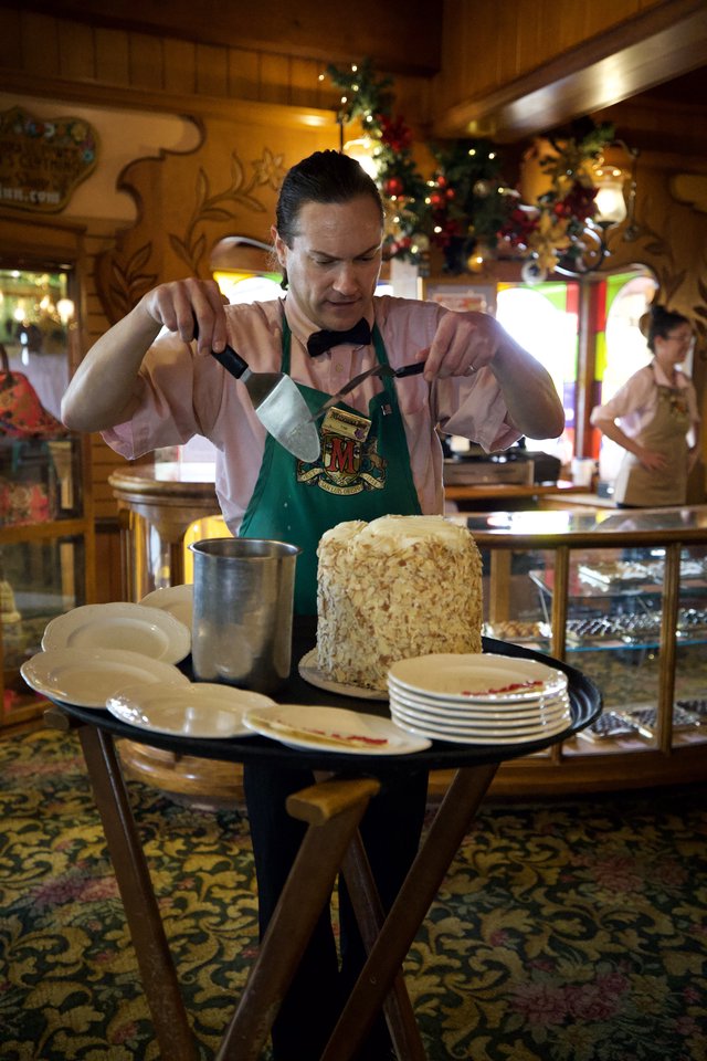 Cast Member Preparing Rice Crispy Treat at Disney Restaurant