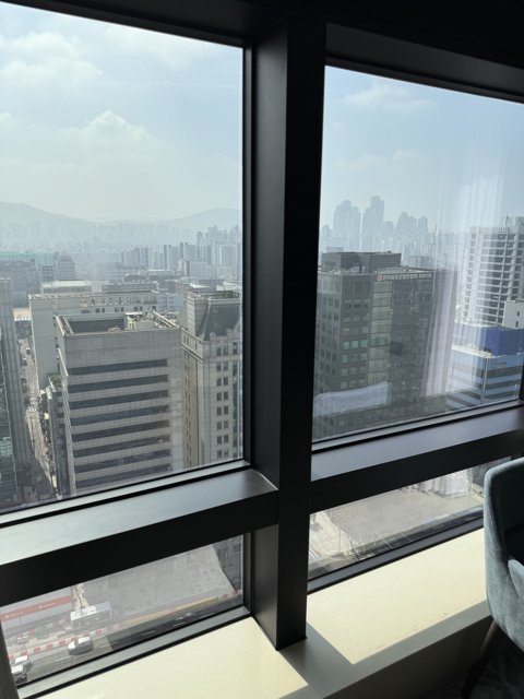 Urban View: Cityscape Through the Window