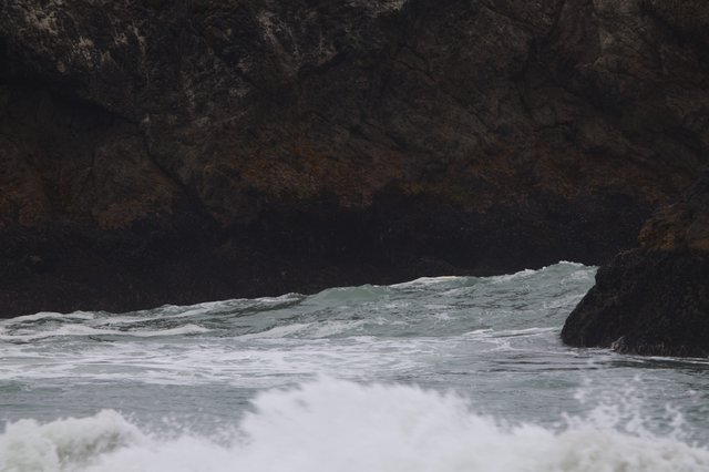 Waves Crashing Through Sea Cave Rocky Cove
