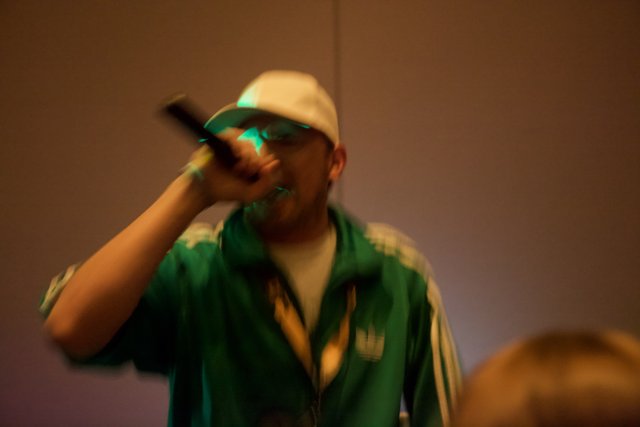 Green-Jacketed Singer on Stage