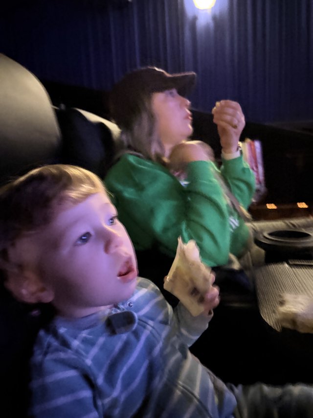 Children Engrossed in Movie Theater Entertainment