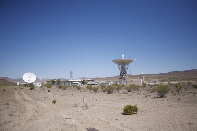 Radio Telescope and Antenna Tower in the Desert