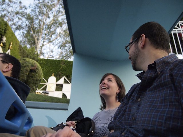 Friends Laughing Together on a Theme Park Ride