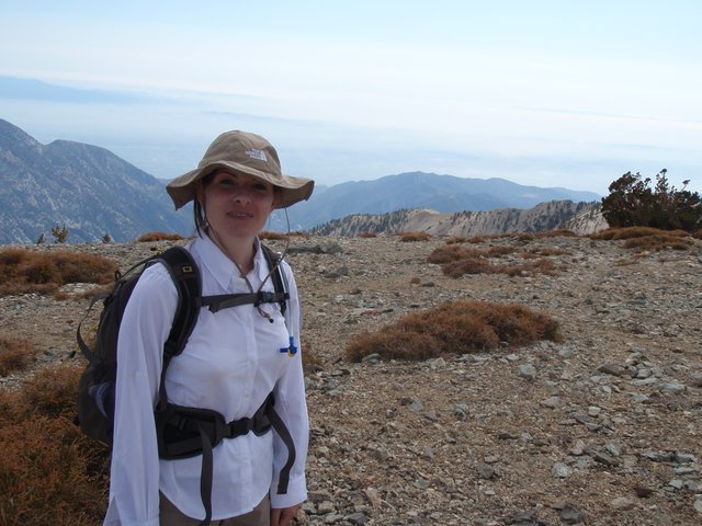 Hiker Pauses at Summit of Mount Baldy