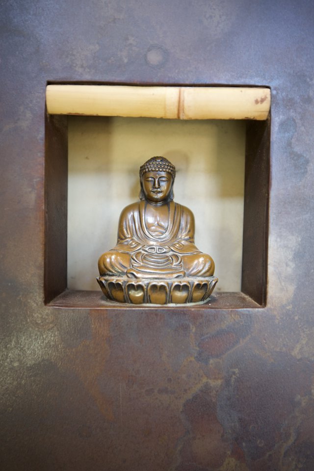 Bronze Buddha Statue in Rustic Wall Niche