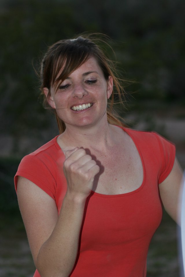 Triumphant Woman Celebrates Victory with Fist Pump