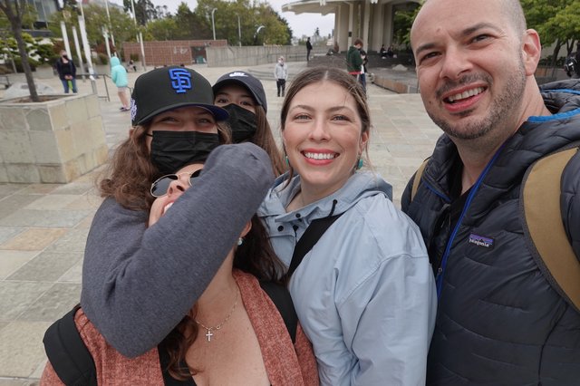 Joyful Group Reunion in Public Plaza