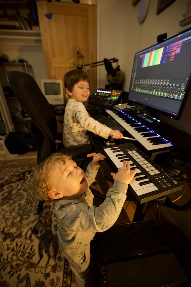 Young Brothers Making Music Together in Home Studio
