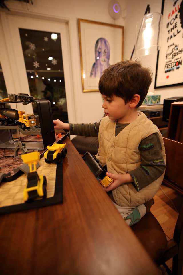 Young Child Playing with Construction Toy Set at Home