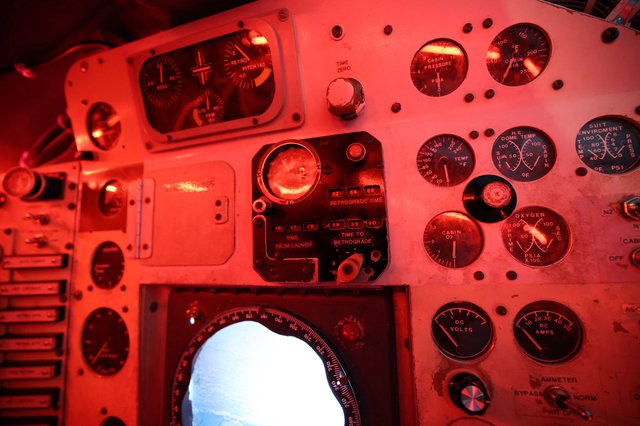 Vintage Spacecraft Control Panel Bathed in Red Light