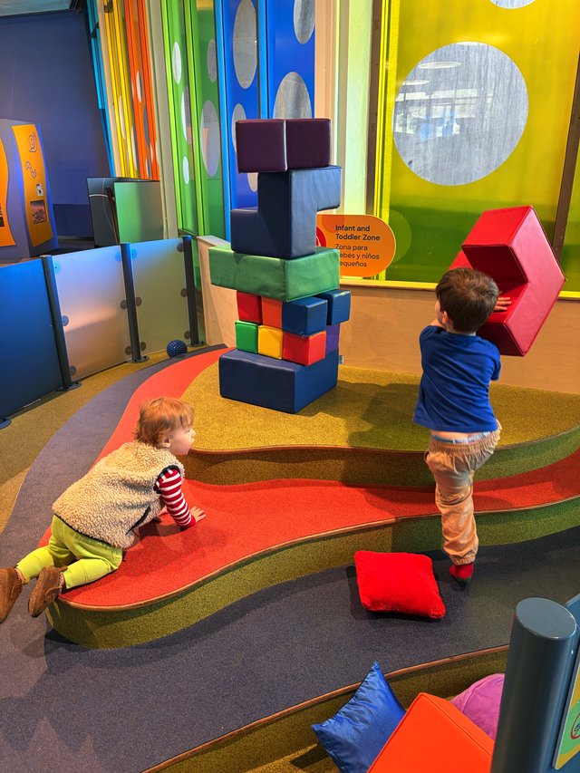 Children Playing with Giant Building Blocks in Museum Play Area