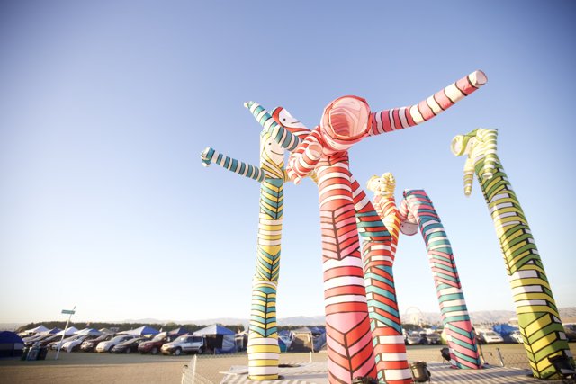 Colorful Paper Sculptures in a Field at Coachella