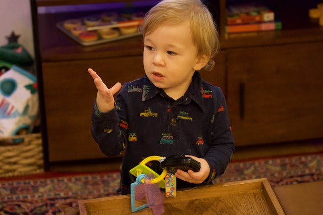 Toddler Playing with Toy Cars at Christmas Time