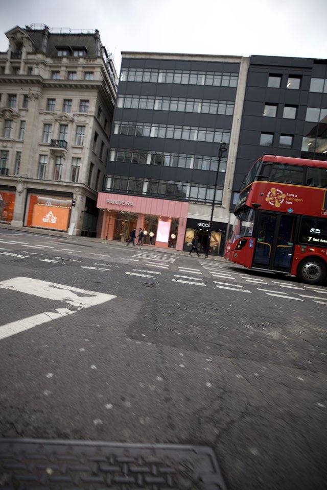 Rainy London Street Scene with Red Double-Decker Bus