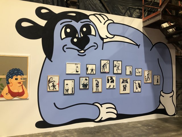 Blue Character Takes Over Art Gallery