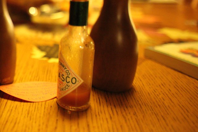 Hot Sauce on a Wooden Table