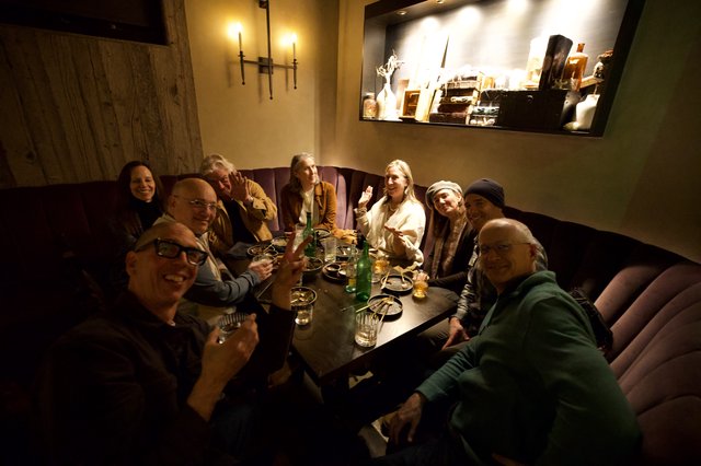 Friends Gathering at Intimate Restaurant Dinner